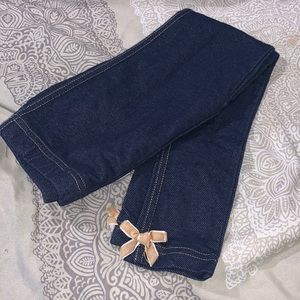 Girls size 6 jegging with velvet bow accent on each pant leg